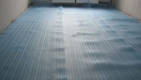 Pose de stratifié sur sol en béton