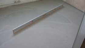 Pose de stratifié sur sol en béton